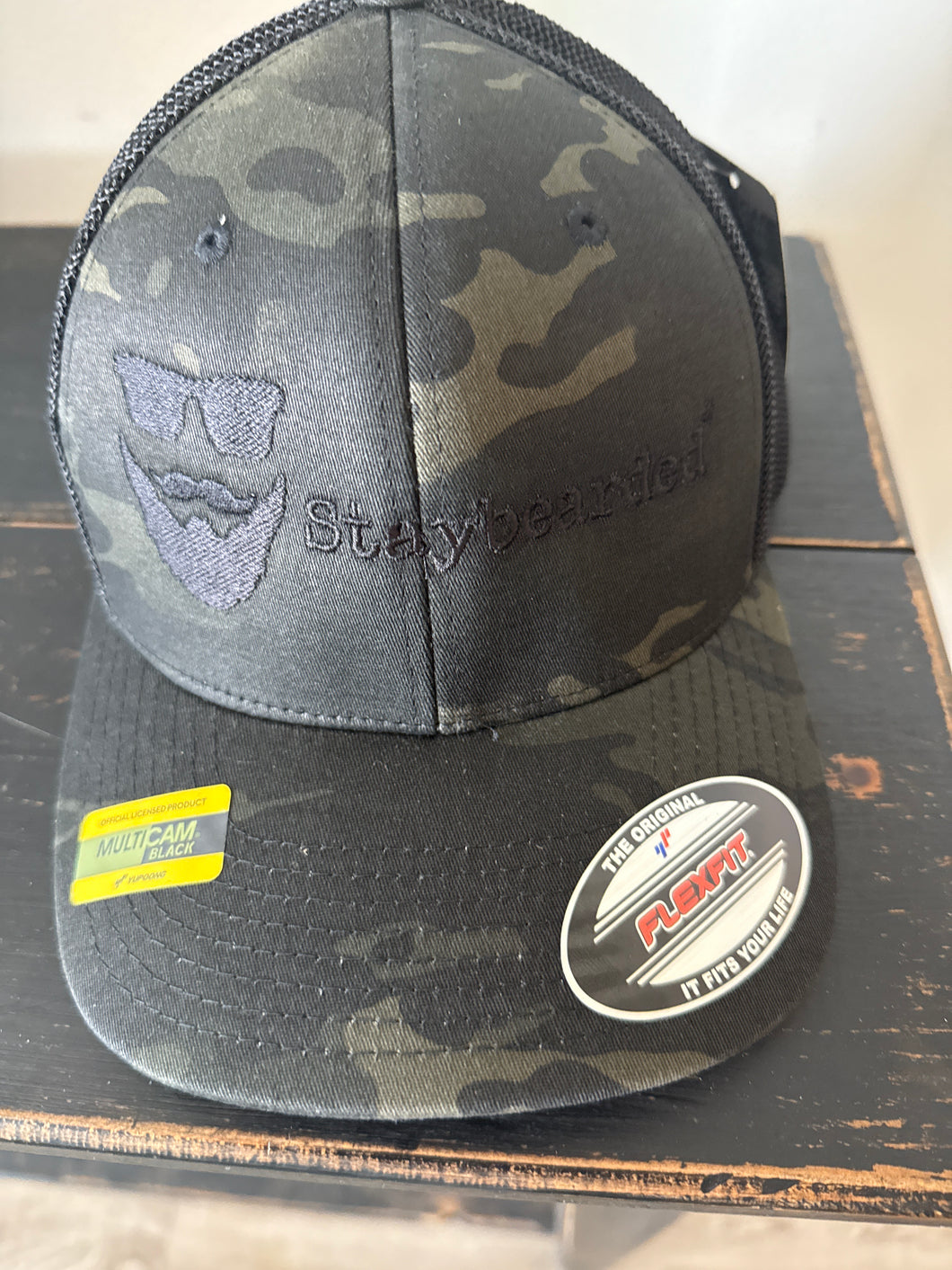 Flexfit “Hats” Camo w/Mesh back. Black embroidery